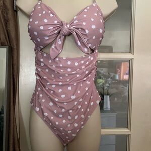 Pink polka dot one piece swim suit. M